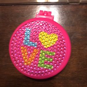 A mirror that comes with a brush